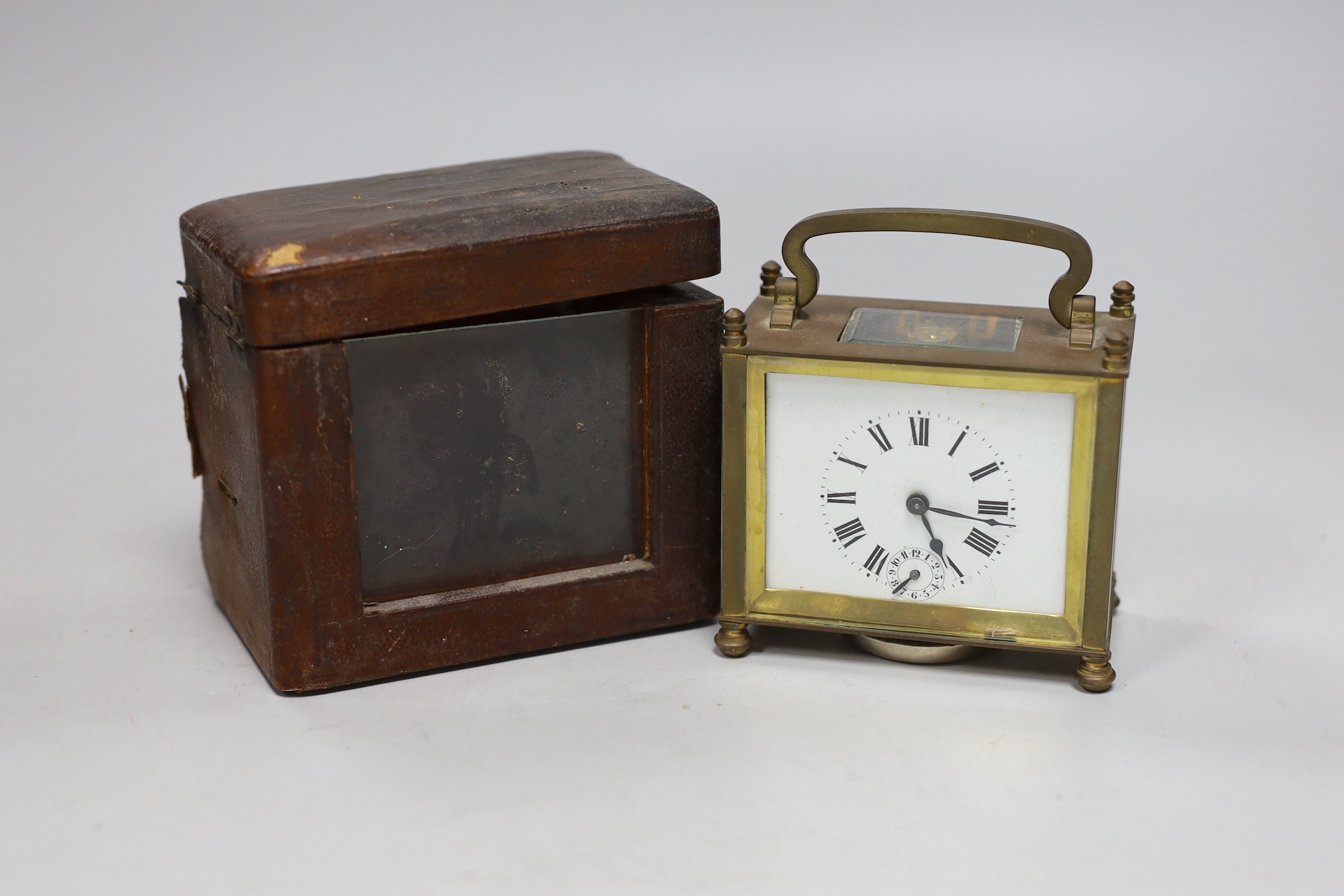 A lacquered brass carriage clock, 12cm wide, cased